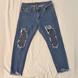 Distressed Blue Jeans with Sheer Patches